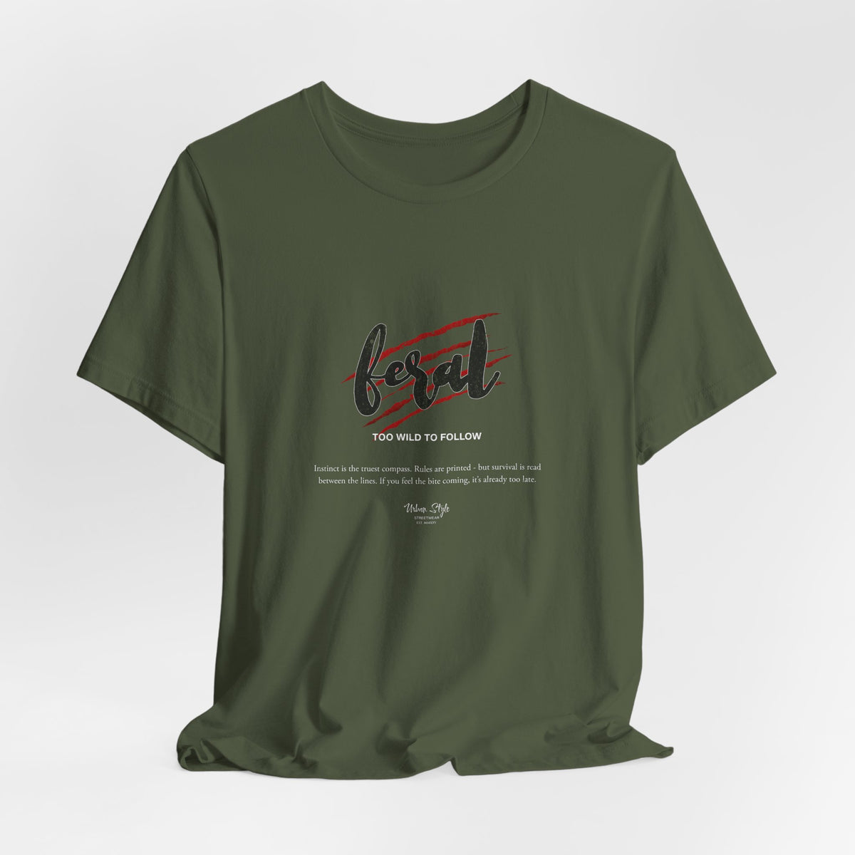 The FERAL t-shirt in Military Green — wildness belongs to the forest, and so do you.