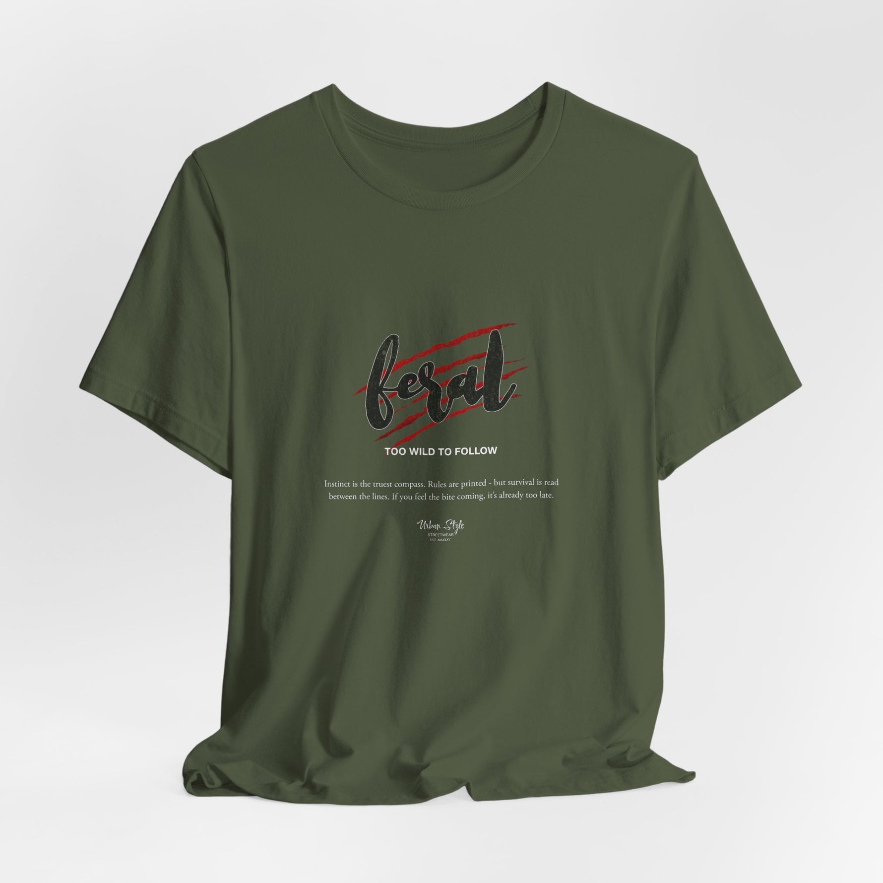 The FERAL t-shirt in Military Green — wildness belongs to the forest, and so do you.