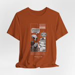 The Satisfiction t-shirt in autumn — 3D mockup showing the shirt in a warm earthy orange tone. No background or model included.