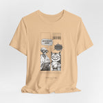 The SITONLAPTOPS t-shirt in Sand Dune — 3D mockup on a warm sand-colored shirt, no model, no background. Design still legible with muted backdrop.