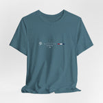 The BANGKOK t-shirt in Heather Deep Teal — a moody teal reflecting rivers and tropical storm skies.