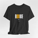 The ROOKIE t-shirt in Dark Heather Grey — steady, unsure, but stepping in.