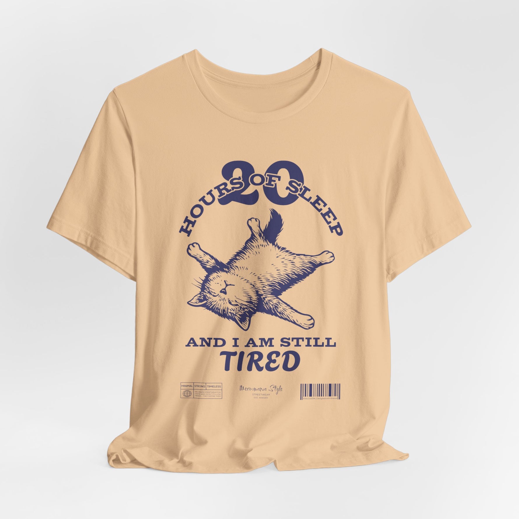 3D mockup of the “STILL TIRED” t-shirt in Sand Dune — warm beige tone with no background or model.