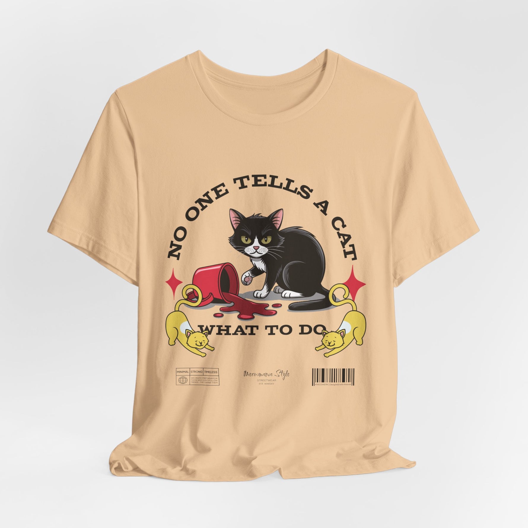 The No One Tells a Cat t-shirt in sanddune — ghost mockup showing a pale beige tone with no background or model.