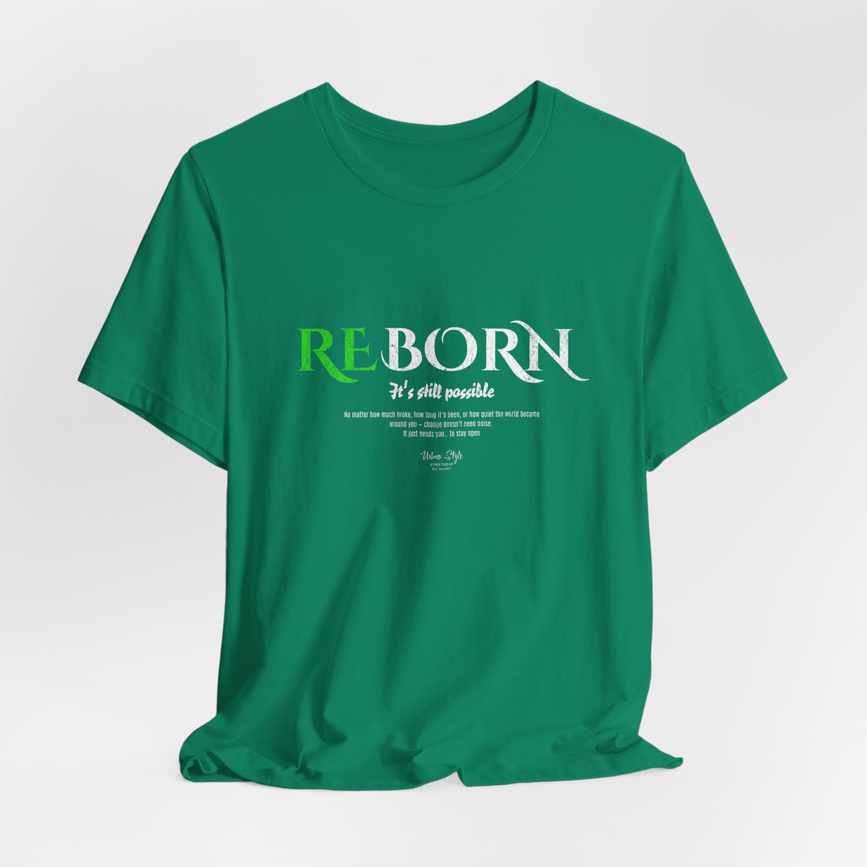 The REBORN t-shirt in Kelly — growth rising in vibrant defiance.