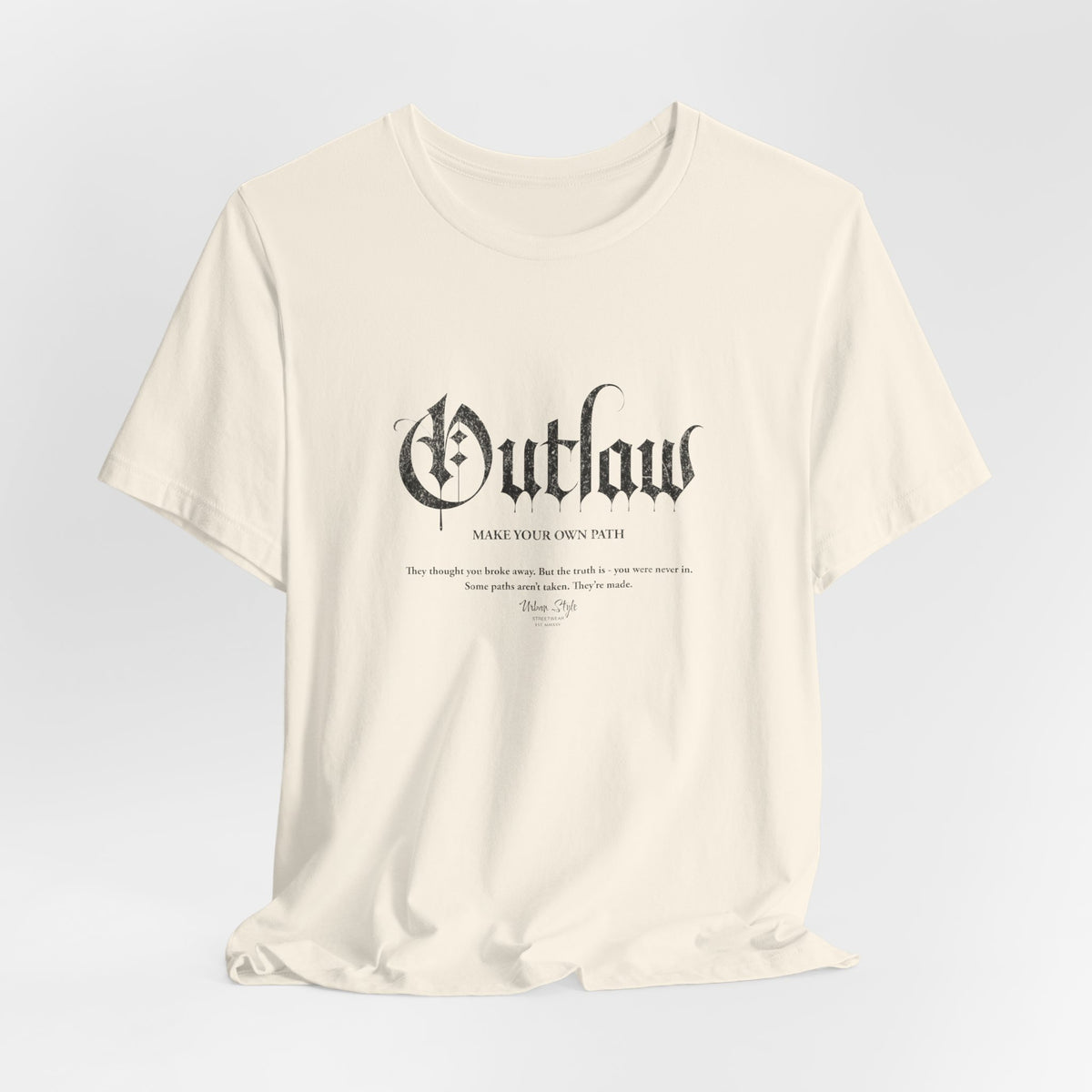 The OUTLAW t-shirt in Natural — raw intent, no filter, no map.