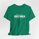 The IDENTITY OBSCURED t-shirt in Kelly — 3D mockup of a bright green shirt. No background. No model.
