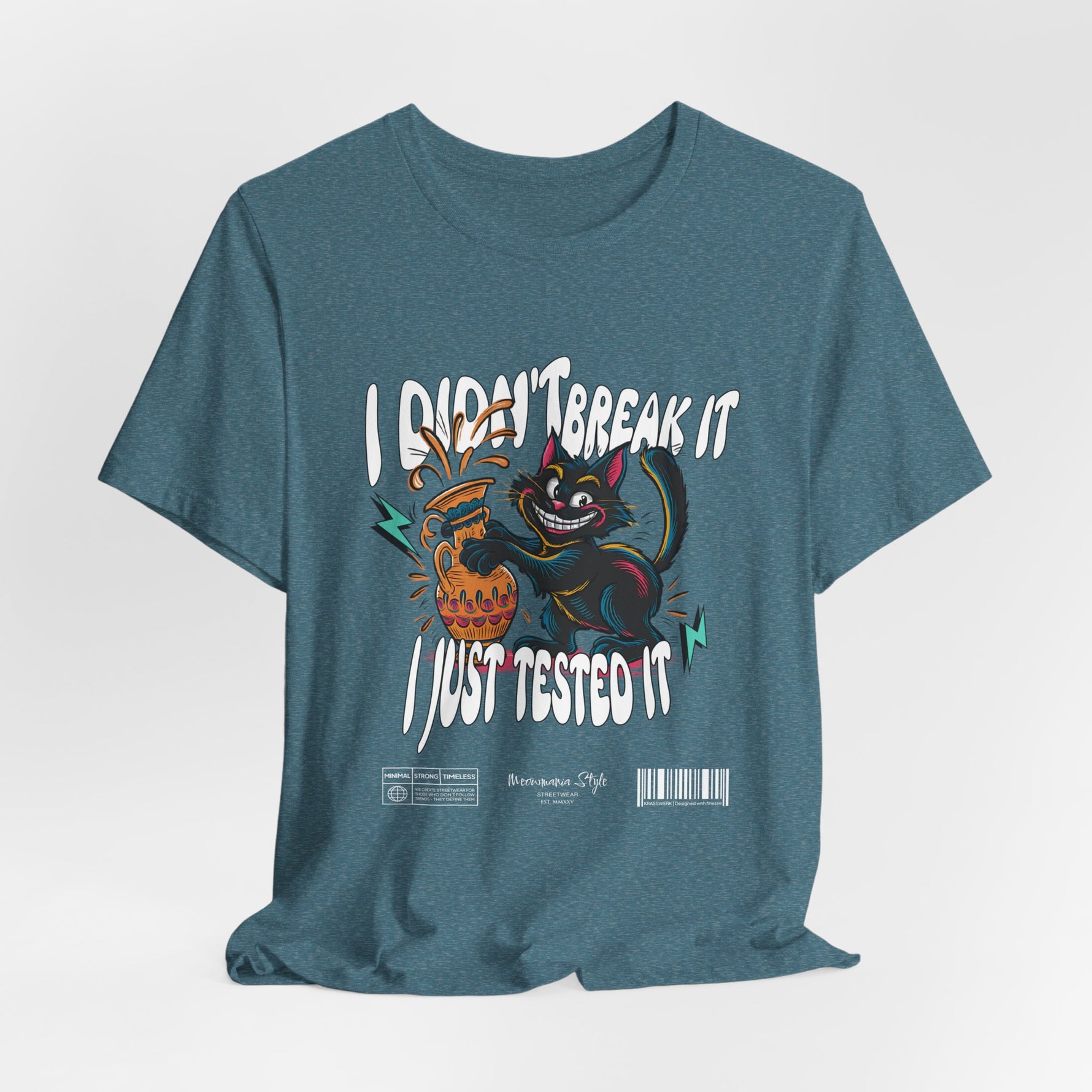 The I Just Tested It t-shirt in heather deep teal — a moody blue-green that adds depth to the vibrant artwork.