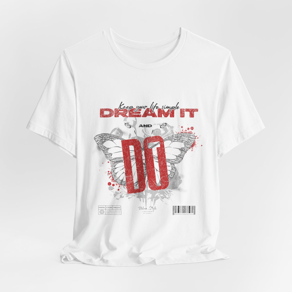 The DREAM IT DO IT t-shirt in White — clean minimal base, making the butterfly and "DO" stand out sharply.