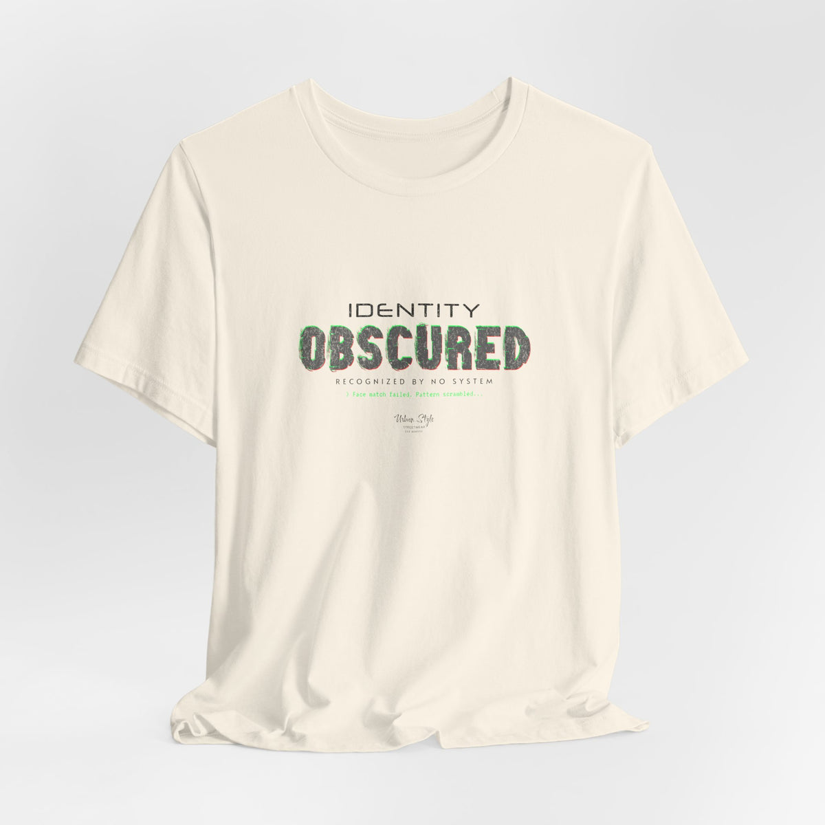 The IDENTITY OBSCURED t-shirt in Natural — 3D mockup of an off-white, cream shirt. No background. No model.