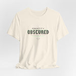 The IDENTITY OBSCURED t-shirt in Natural — 3D mockup of an off-white, cream shirt. No background. No model.