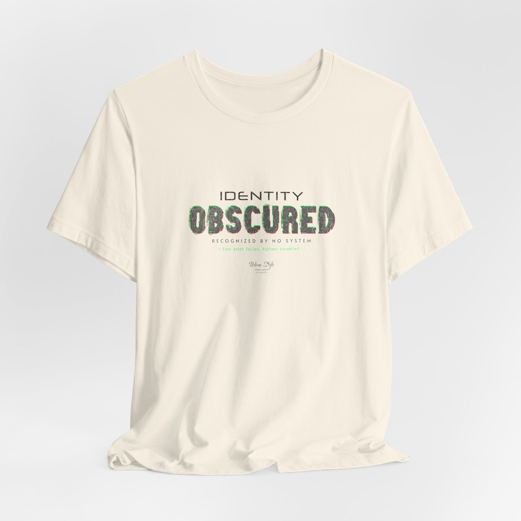 The IDENTITY OBSCURED t-shirt in Natural — 3D mockup of an off-white, cream shirt. No background. No model.