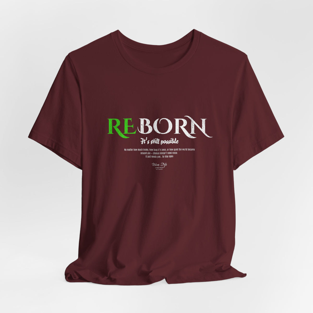 The REBORN t-shirt in Maroon — old wounds, deep strength, quiet rebirth.