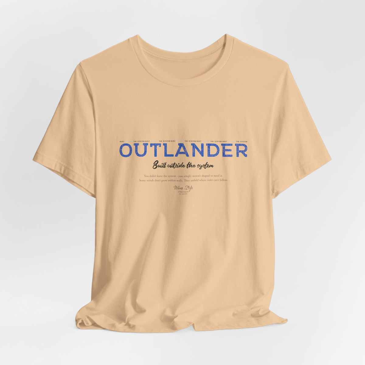 The OUTLANDER t-shirt in Sand Dune — neutral tones for those who walk unseen.