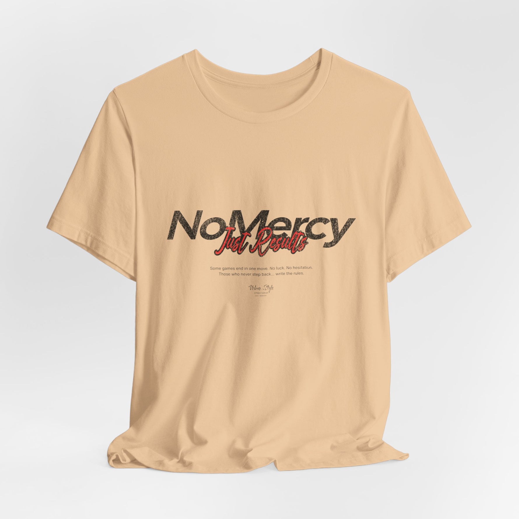 The NO MERCY t-shirt in Sand Dune — dusty paths. Brutal choices.
