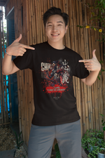 A cheerful man pointing at his CHŪGI t-shirt, part of the 7 Virtues of Bushido collection. The design showcases a bold samurai illustration with the quote "Loyalty is silent, but unbreakable," set against a backdrop of bamboo walls and greenery.