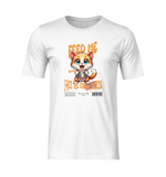 White t-shirt mockup with no background or model, displaying a playful orange cartoon kitten holding a food bowl and the phrase “FEED ME OR FACE THE CONSEQUENCES” in bold orange lettering.