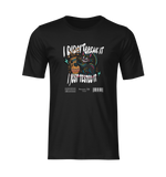 Front-facing 3D mockup of a black t-shirt on an invisible mannequin. The shirt features a colorful graphic of a grinning black cat knocking over a vase, with the bold caption “I Didn’t Break It, I Just Tested It.” No background, no visible model — isolated on a transparent background for product display purposes.