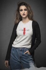 Female model in denim jeans and a black cardigan, wearing the “LOSTSOUL” white t-shirt. The design features transparent smoky text and a bold red downward arrow. Shot against a dark grey background with a gritty, cinematic tone.