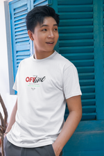 A young man in a white “UNIT OFFLINE” T-shirt smiles and looks to the side. He stands near blue wooden shutters in daylight, highlighting the bold red “OFF” text in the center of the design.