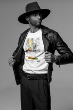 Model showing off the “SUMMER MODE Activated” t-shirt in white — vibrant tropical design contrasted with grayscale panels, styled with a leather jacket and wide-brim hat.
