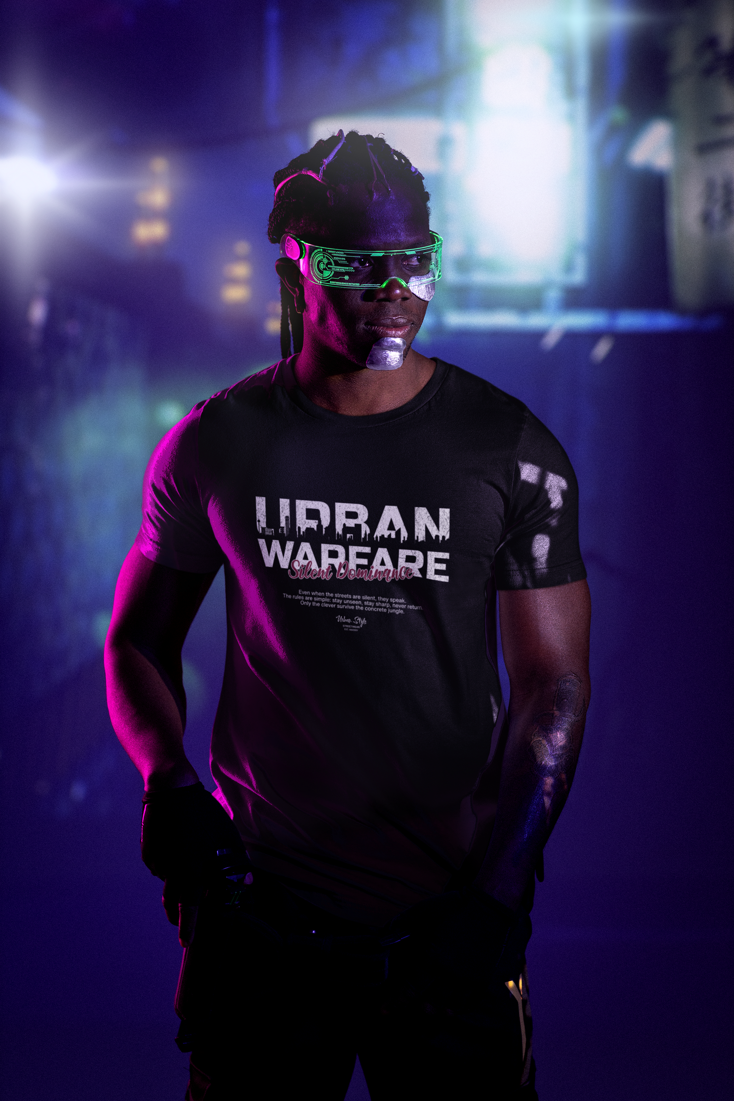 Black URBAN WARFARE t-shirt worn by a futuristic model in cyberpunk lighting — features bold white text and red “Silent Dominance” script, set against a neon-lit city alley.